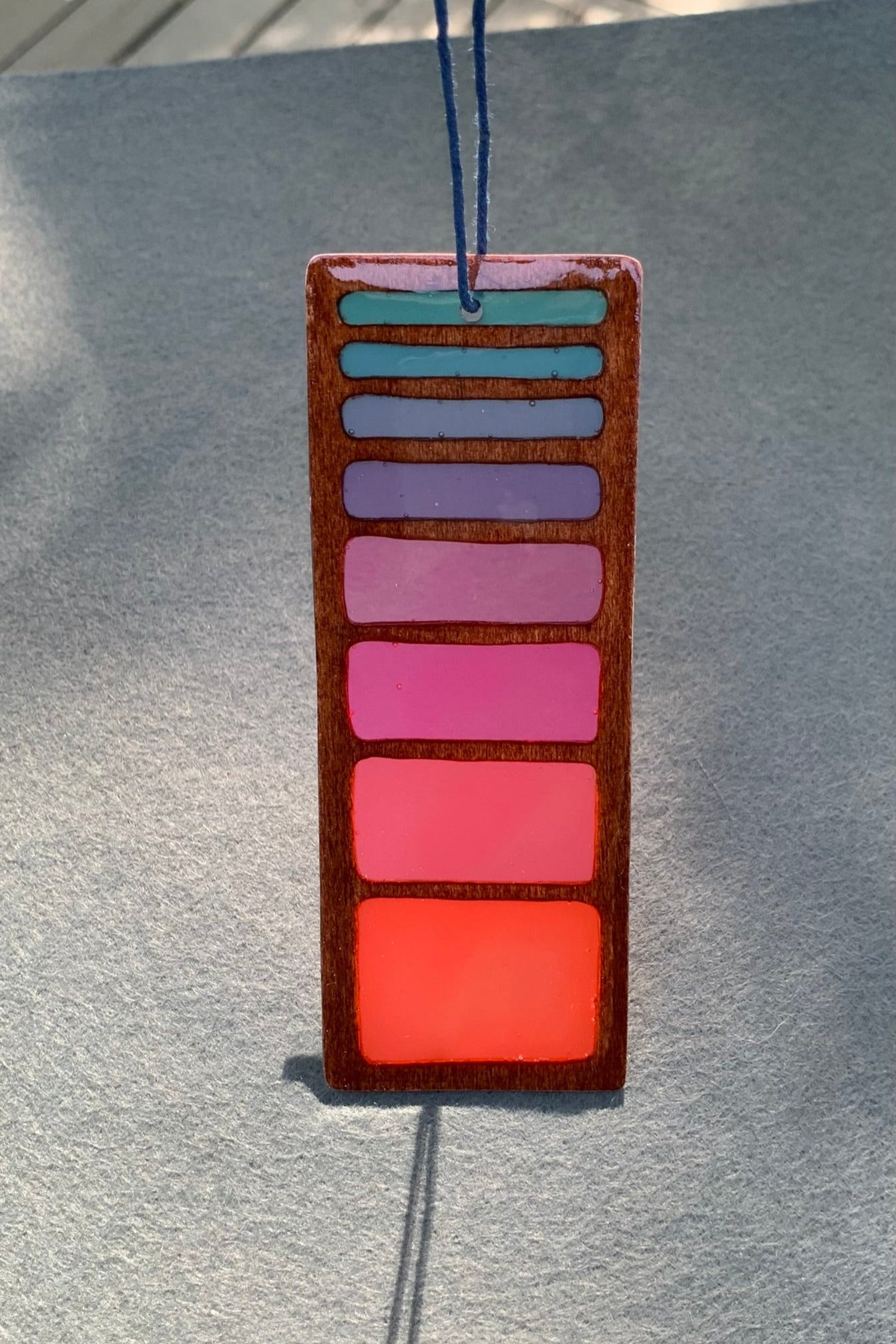 Hand cut wooden bookmark with retro line gradient colors and UV resin translucent colors