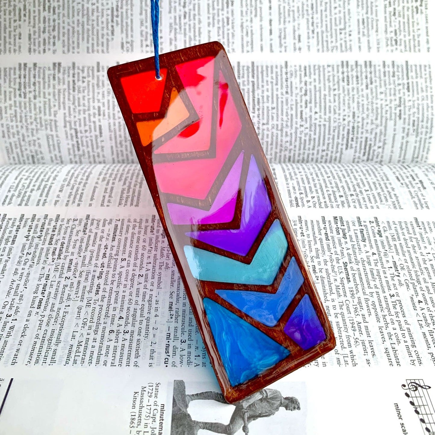 Colorful geometric glass panel on a dictionary background