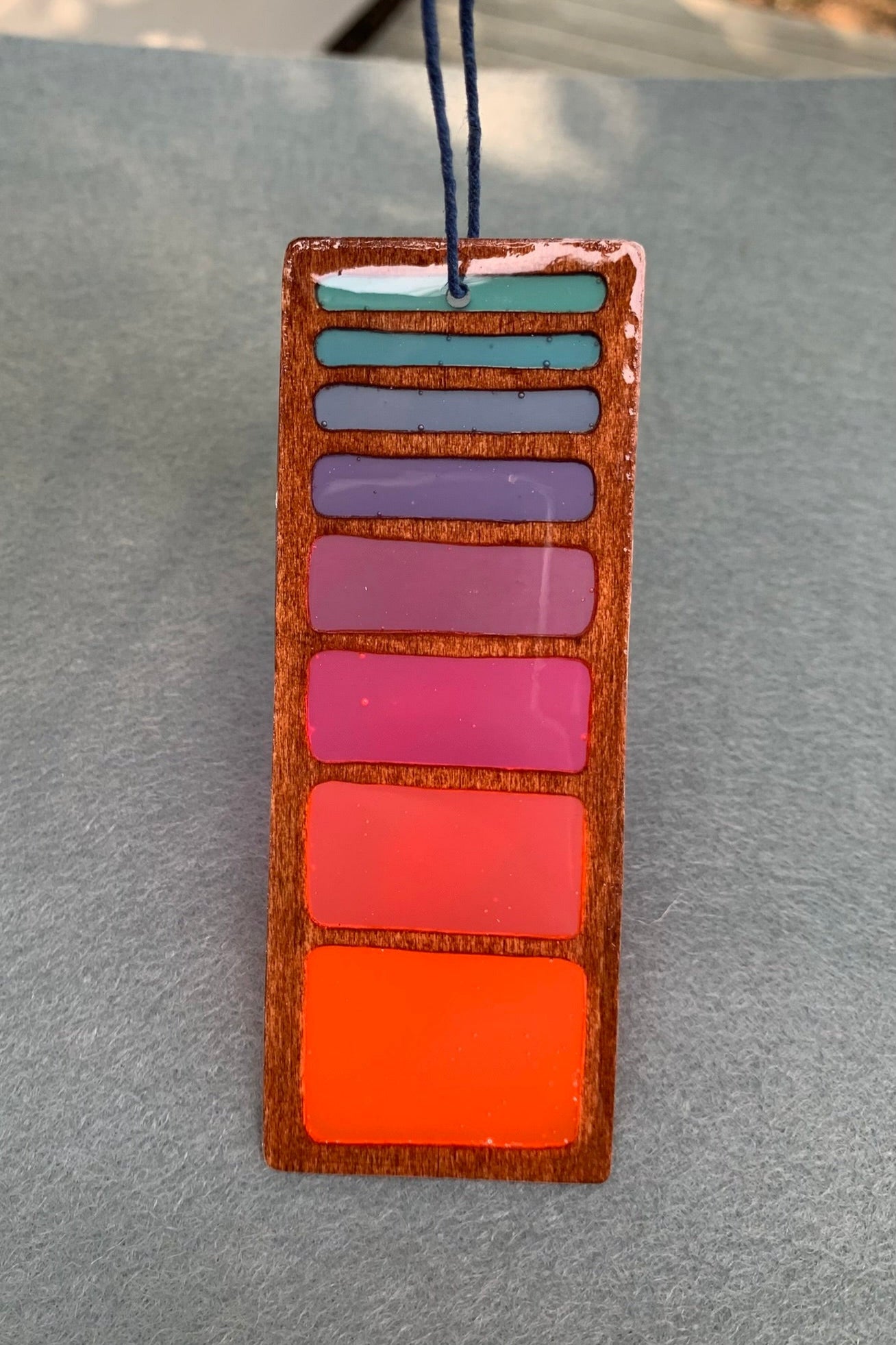 Hand cut wooden bookmark with retro line gradient colors and UV resin translucent colors