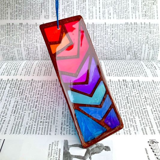 Colorful geometric glass panel on a dictionary background